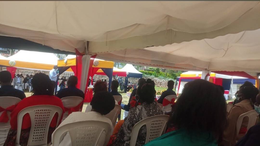 Guests seated under colourful function tents