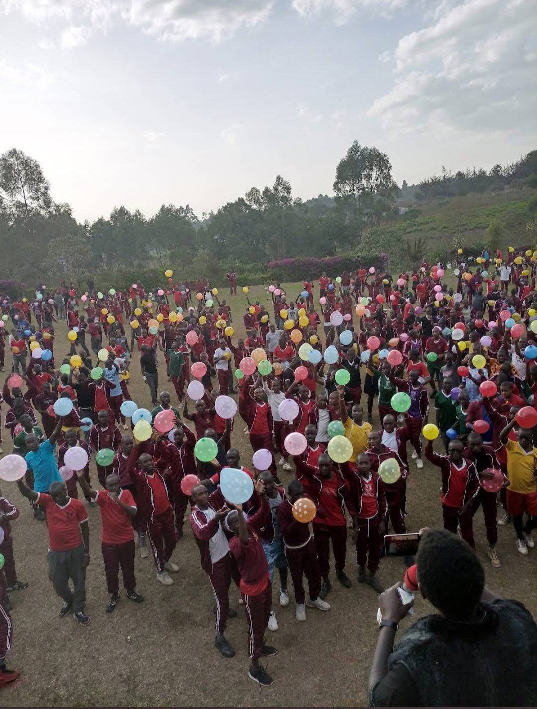 A large school group gathered on the grounds for a retreat